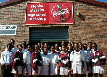 project students stand below the ngaka high truck stop sign