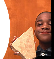 Victor holding a piece of limestone