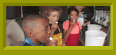 Khalil, Noah, and Taylor sampling food.