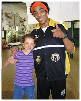 Anna and Hip Hop artist, Wyatt, holding their thumbs up.