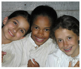 Taylor, Anna, and Julia in white shirts.