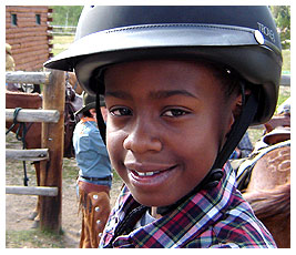 Mike on the dude ranch riding his horse.