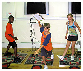 Mike, Willie, and Madi working out at a gym.