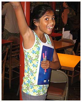 Nina with her notebook and markers at the poetry club.