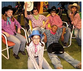 FETCHers at the dude ranch wearing their cowboy hats.