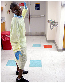 Mike wearing a doctor's coat and dancing in the hospital corridors.