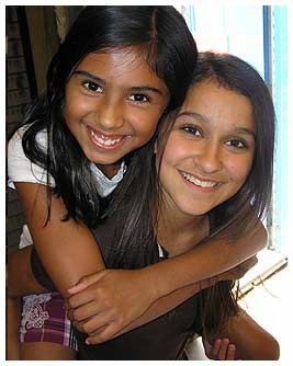 Season One FETCHer, Julia, gives Nina a piggyback ride.