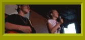 Lisa and Sterling singing on stage.