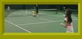 Talia playing tennis.