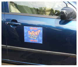 A sign on a car's passenger door reads: “Official FETCH! With Ruff Ruffman vehicle.”