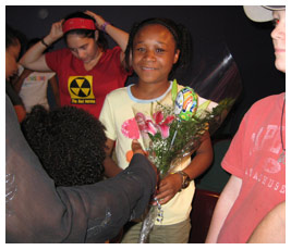 Bethany holds a bouquet of flowers.