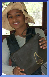 Marc wears a floppy straw hat.