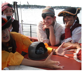 Jay, Marco, Emmie, and Shreya wear pirate costumes.