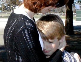 Mother hugging child