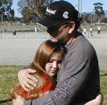 Father hugs daughter