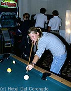 Girl shooting pool