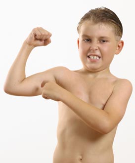 Boy flexing bicep muscle