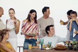 Young adults and kids at table