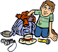 Boy packing camp gear