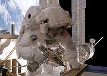 An astronaut works on the space station