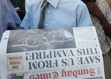 Photo of newspaper with article about Mugabe