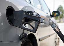 A car getting fueled up at the pump