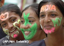 Indian and Pakistania children celebrate by painting their faces.