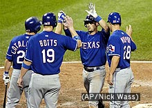 Photo of the Texas Rangers celebrating after a home run.