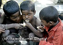 Photo of three kids in India living in poverty.
