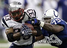 Photo of the New Englan Patriots running the ball.