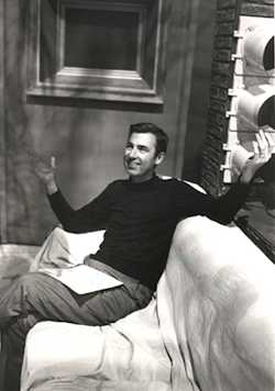 Mister Rogers sitting on couch