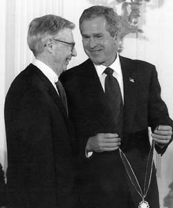 Receiving the Presidential Medal of Freedom from President Bush.