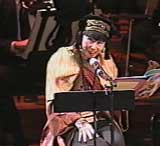 screenshot of Amy Tan reading at the concert