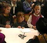 screenshot of children at the booksigning