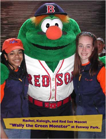 Rachel, Kaleigh, and Red Sox mascot Wally the Green Monster at Fenway Park.