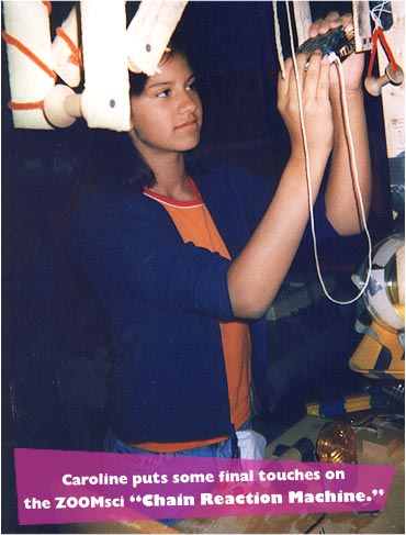 Caroline puts some final touches on the ZOOMsci 'Chain Reaction Machine.'
