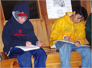 Kyle and Francesco do a little homework (in a yurt) at campZOOM.