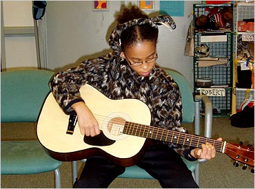 Maya playing a tune in the ZOOMroom.