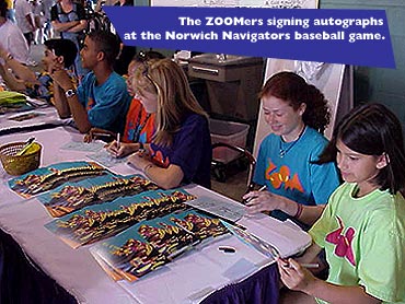 The ZOOMers signing autographs at the Norwich Navigators baseball game